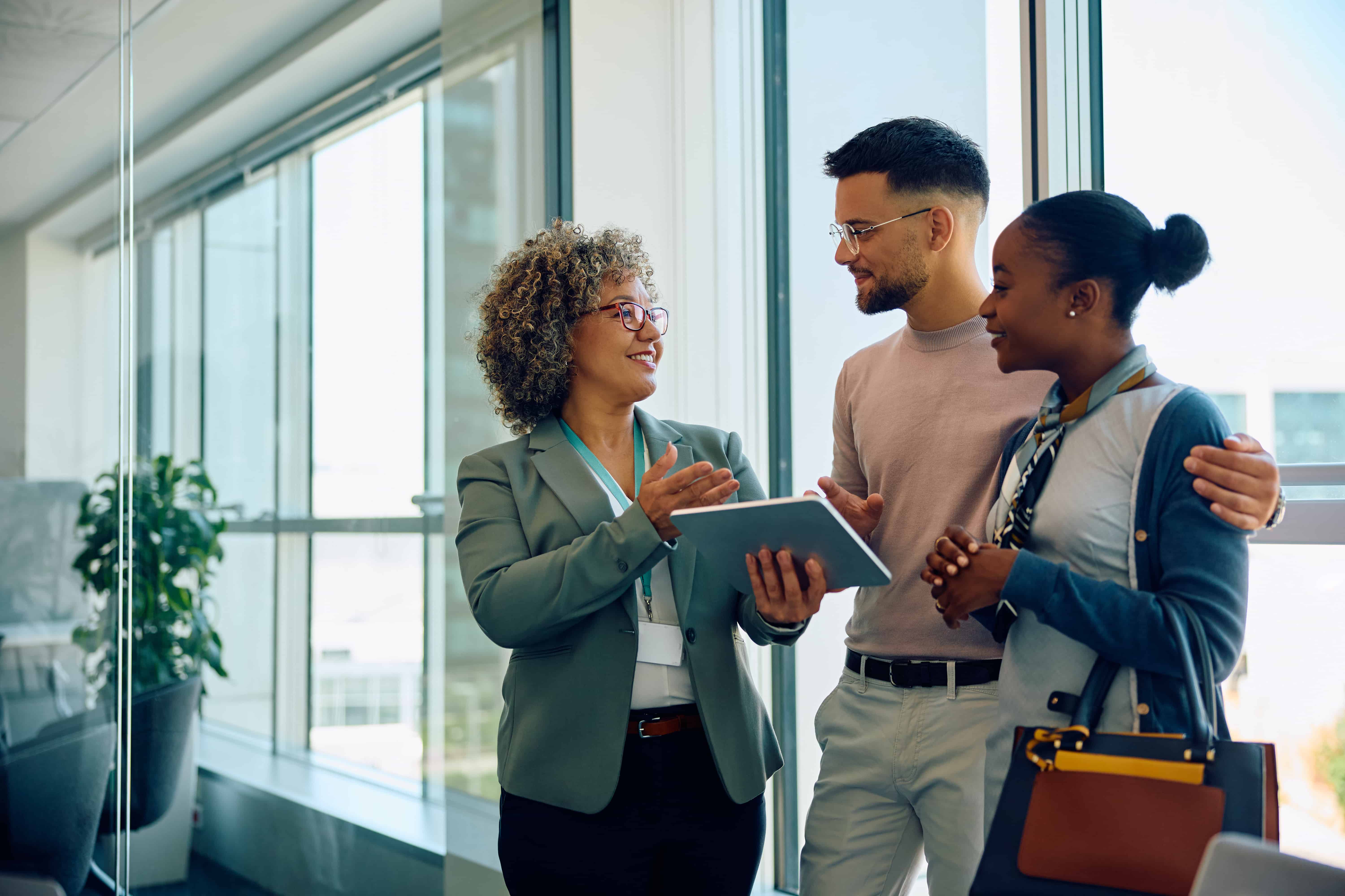 Young couple talking to their advisor