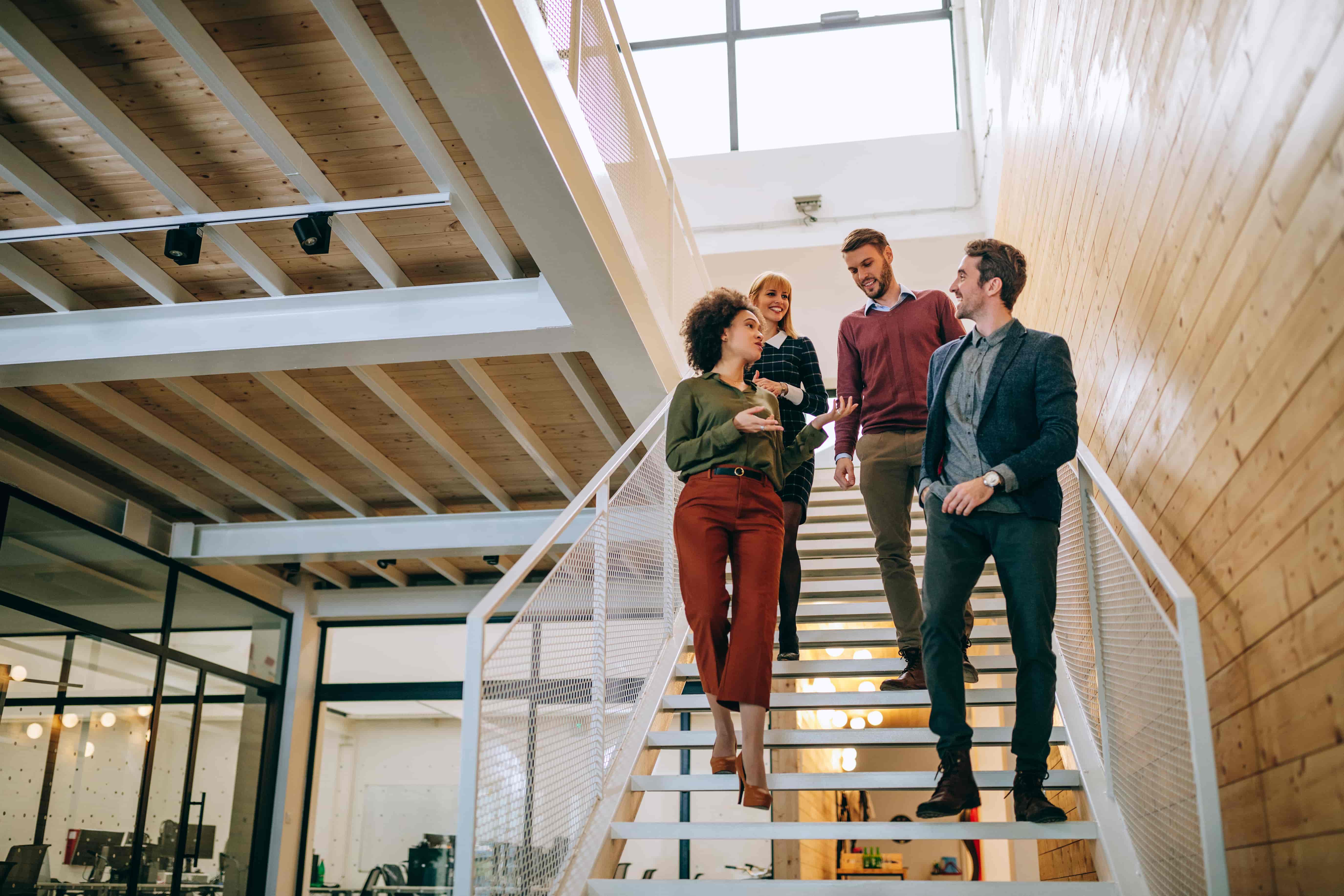 Young professionals walking down the stairs